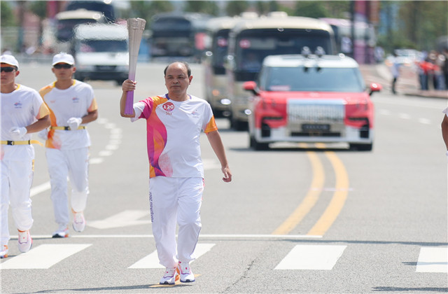 亞運火炬手韋曉青：參與“大蓮花”建設，傳遞火炬一生難忘